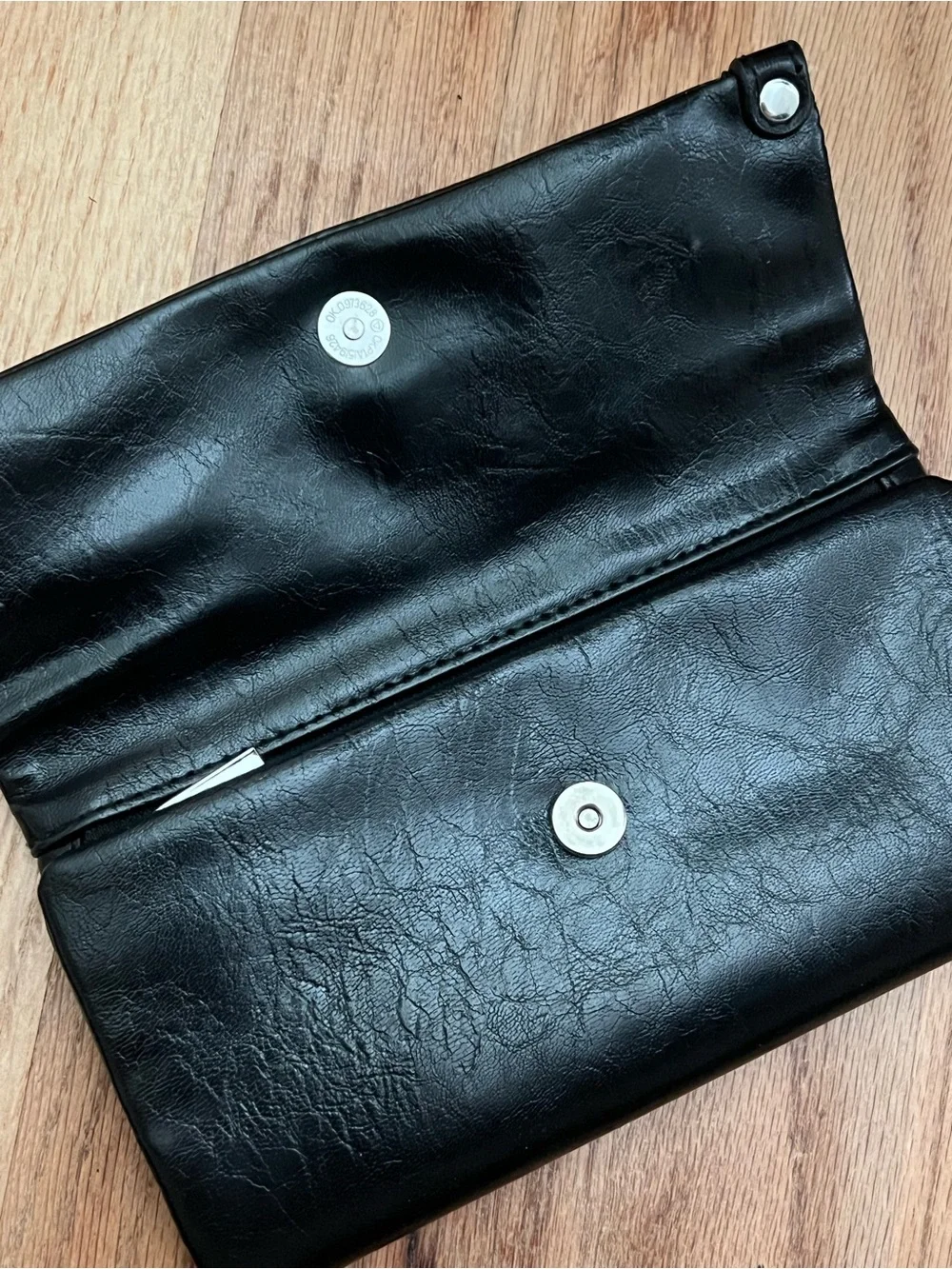Black Fold-Over Clutch Wallet new without tags. Never used. Genuine leather